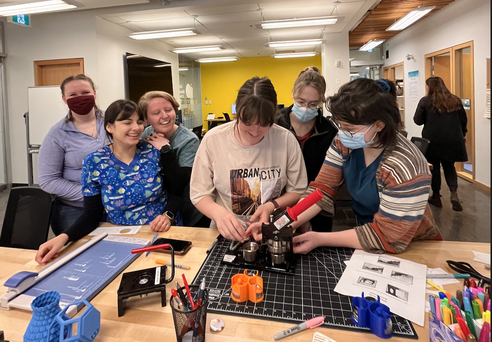 VTEC Students using a button Maker