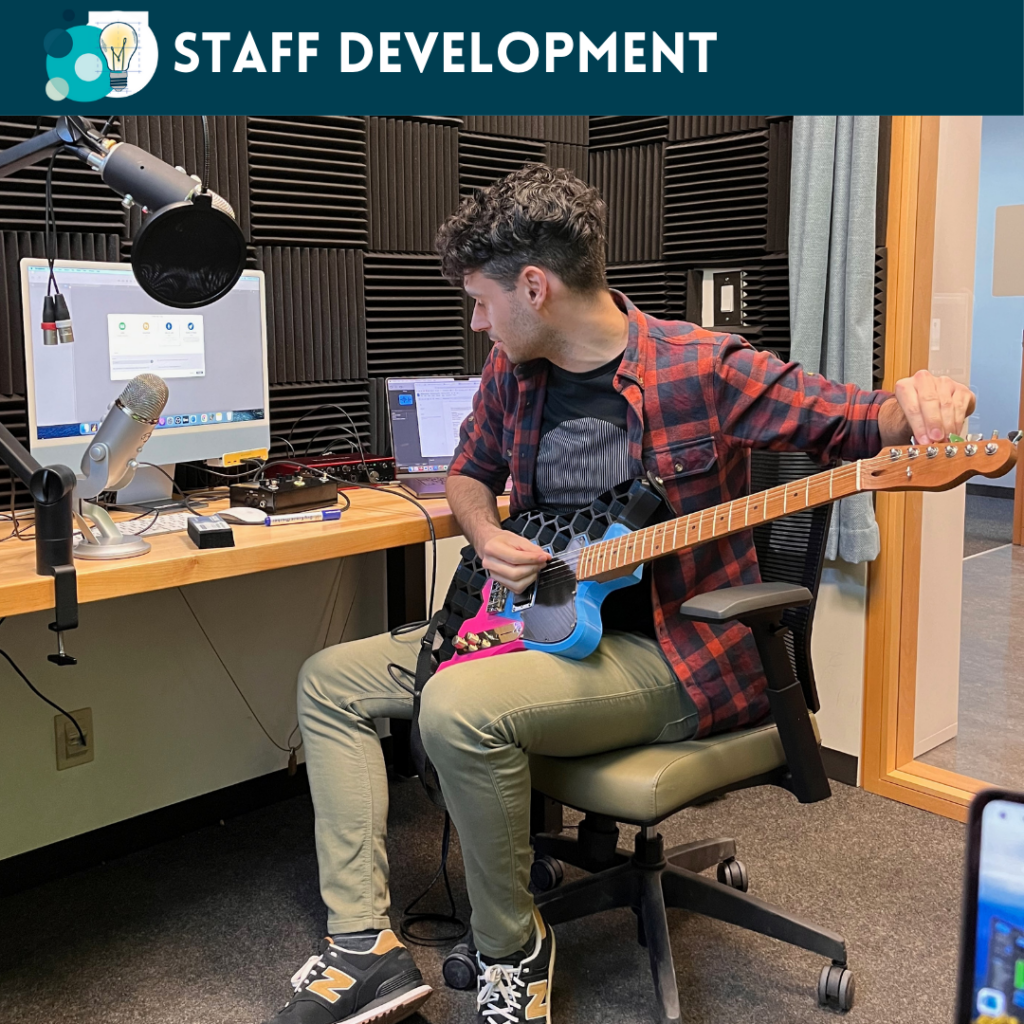 Our Collections Librarian, Joey da Costa, who also supports the Makerspace, with a guitar he 3D printed during a workshop on audio recording